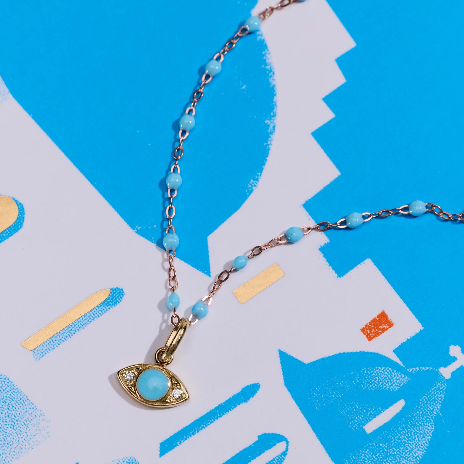 Photo d'un pendentif Eye turquoise, diamant sur un collier classique Gigi Clozeau 